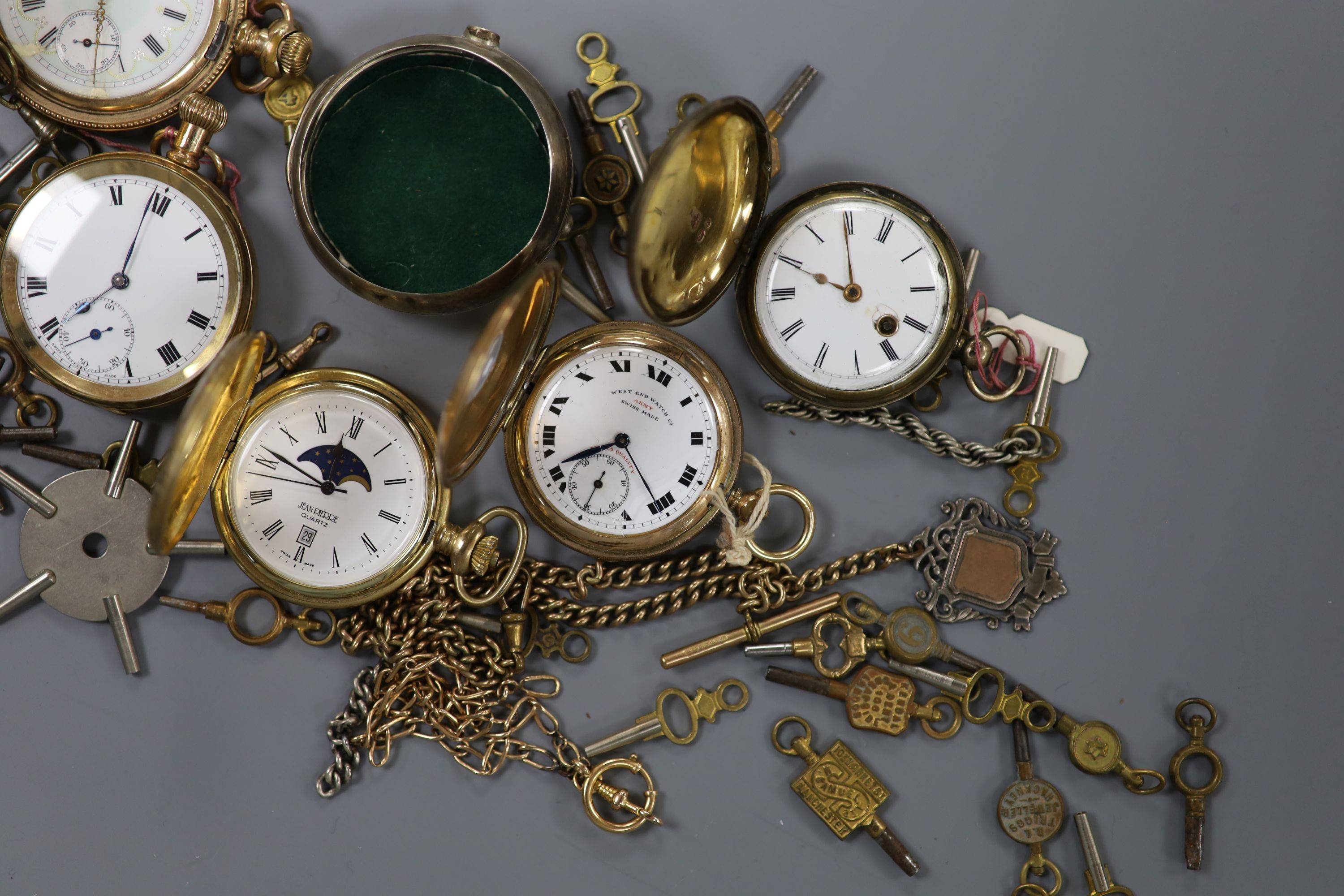 An early 20th century gold plated keyless pocket watch, a gold plated half hunter, three other pocket watches and watch accessories, including keys.